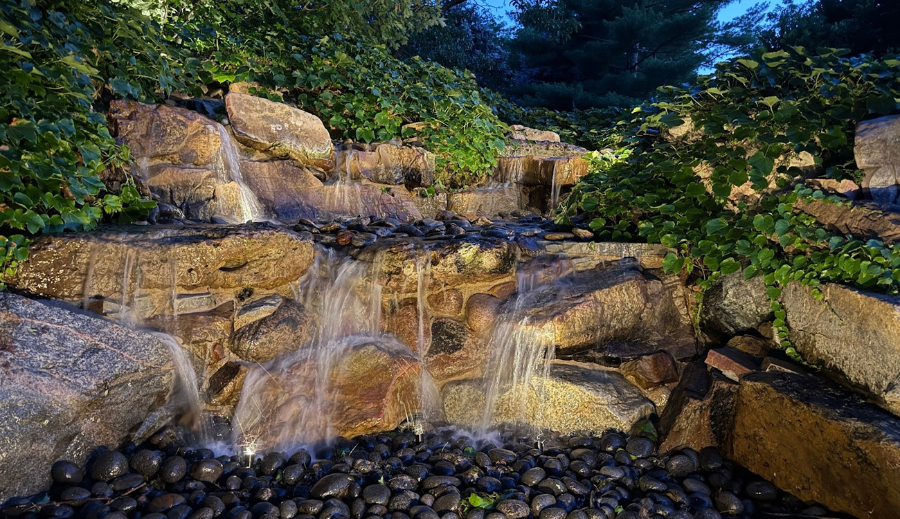 Serene waterfall with lush greenery.