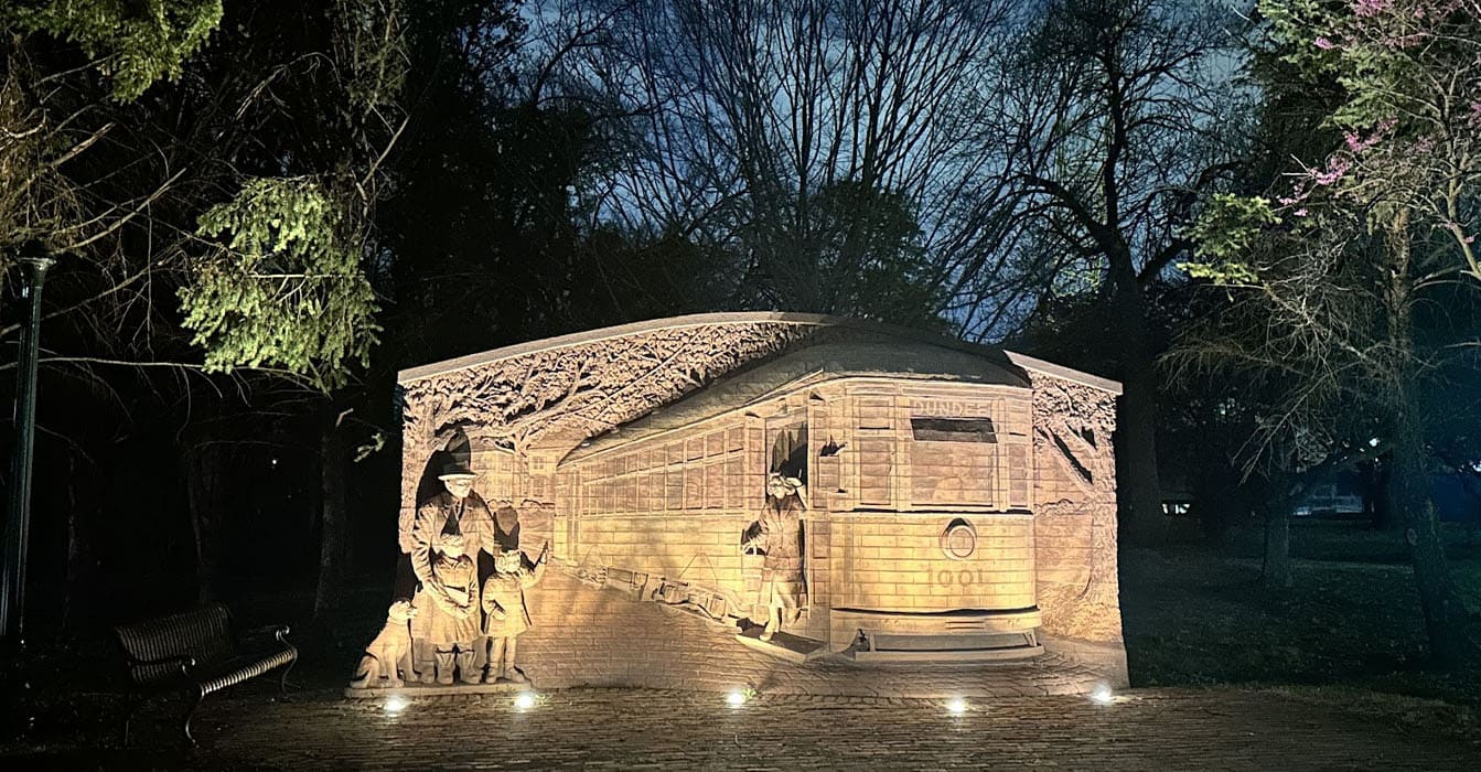 Outdoor monument lighting designed by a commercial lighting contractor to highlight architectural details at night.