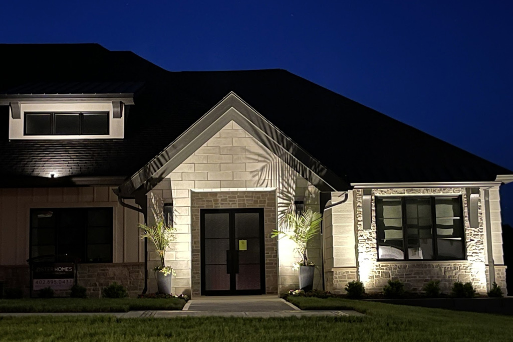 Elegant home illuminated at night.