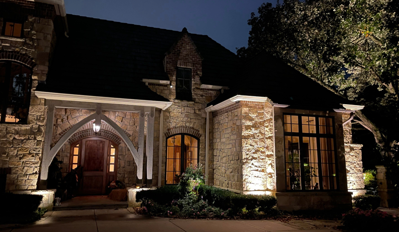 Driveway security lighting illuminating a residential driveway at night