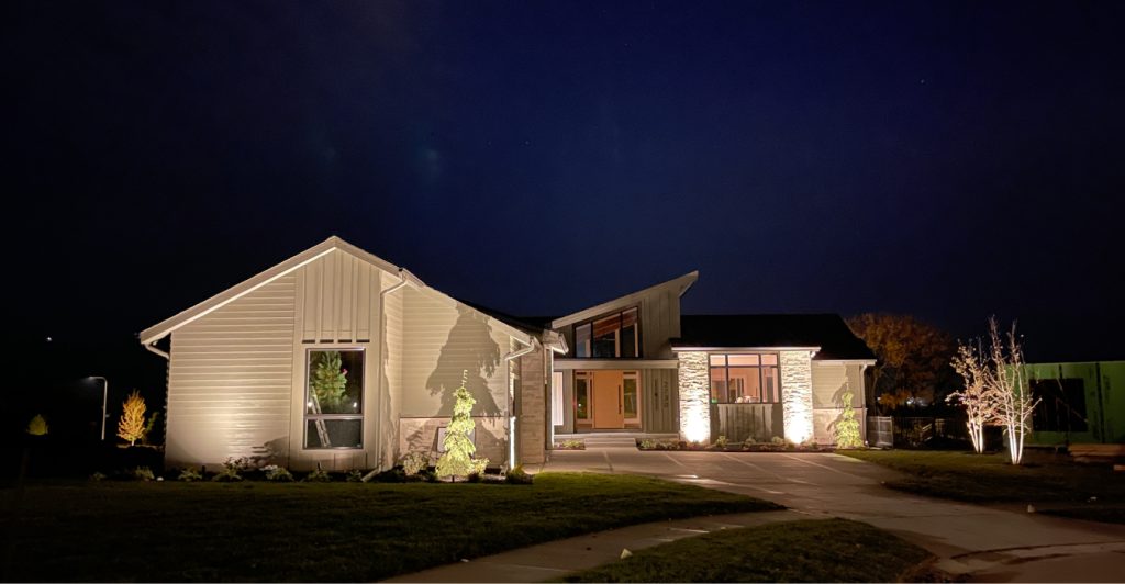 Dramatic nighttime tree lighting using high-quality outdoor light fixtures for a large Midwest property.