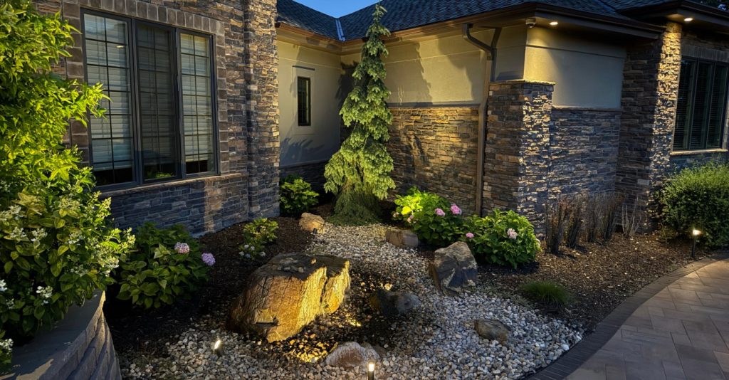 Outdoor lighting for homes highlighting trees and landscaping