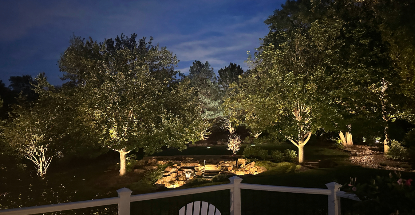 landscape lighting omaha neighborhoods west omaha home with LED uplights and path lights at night