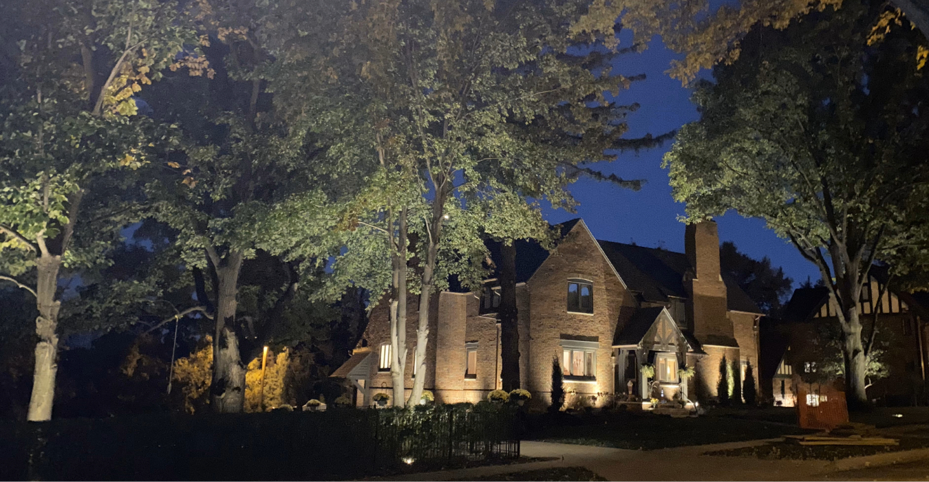 outdoor lighting cost omaha residential home with pathway and uplighting at night