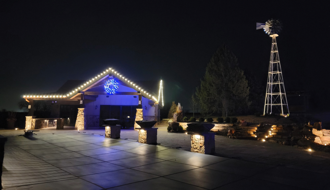 permanent christmas lights omaha two-story home roofline RGBWW LED display at night