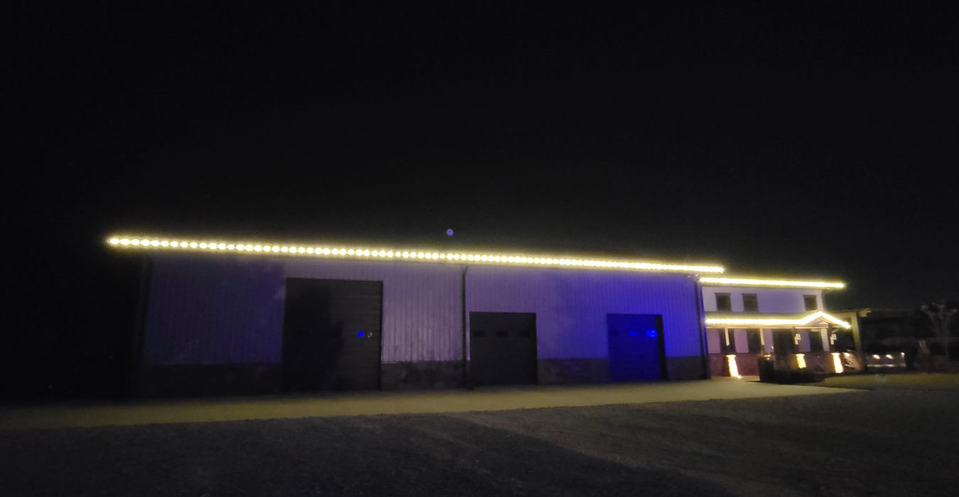 permanent roofline lighting omaha two-story home full color RGBWW eave display at night
